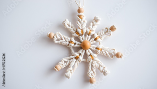 Christmas macrame decor. Christmas snowflake on lockram. Natural materials - cotton thread, wood beads. Eco decorations, ornaments, hand made decor. Winter and New Year holidays photo