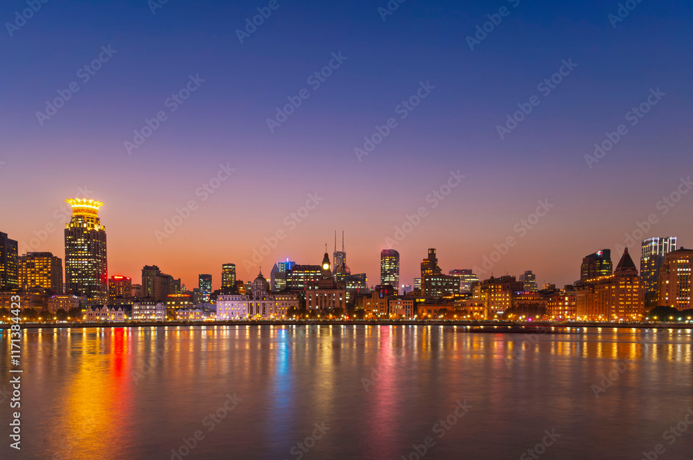sunset or sun rise of Historical architecture on the bund of Shanghai with reflection of buildings in city Shanghai, China