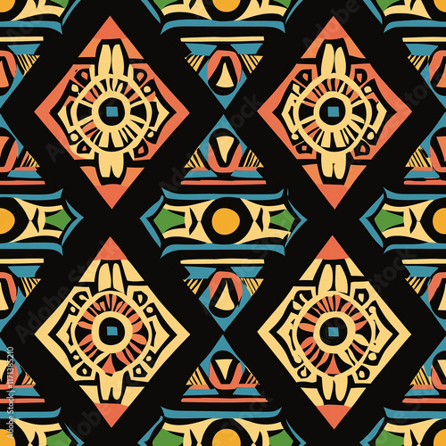 Vibrant geometric pattern featuring diamond shapes and circular elements in warm colors against a black background. photo