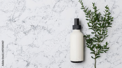 Minimalist White Bottle with Black Cap and Green Leaf on Marble Background photo