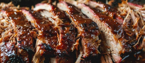 Close-up of sliced barbecue ribs glazed with sauce. photo