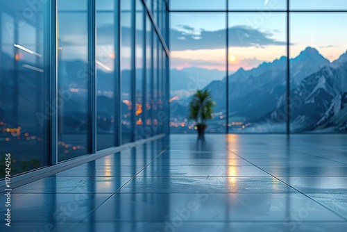 Modern office with stunning mountain view at sunset.