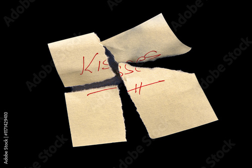 Yellow adhesive paper, similar to a Post-it note, torn into four pieces and reassembled like a puzzle, on a black background with the word 