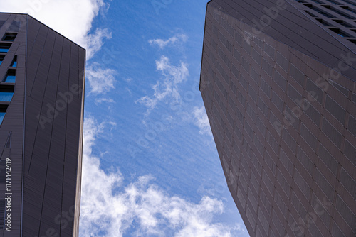 Geometric silhouette of modern buildings against a clear sky photo