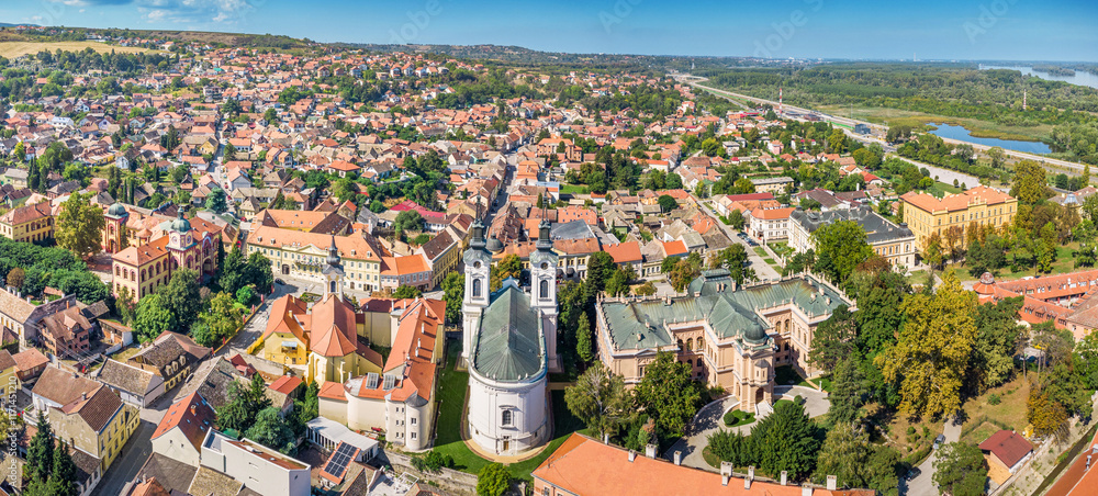 A panoramic aerial view of Sremski Karlovci highlights the stunning summer landscape, with its unique heritage and vibrant urban center nestled in Vojvodina, Serbia