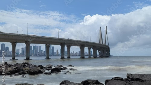 Mumbai, India- 2024, Sep 8: Timelapse of Waves and Clouds around Sea Link Bridge photo