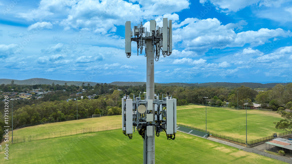 Drone aerial photograph of the top section of a telecommunications tower equipped with antennas and transmission equipment used for communications in regional New South Wales, Australia.