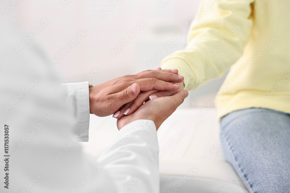 Fototapeta premium Healthcare worker supporting patient in hospital, closeup