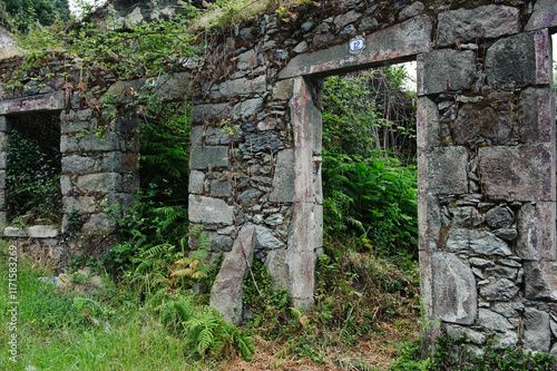 old stone door with number 12 in the village