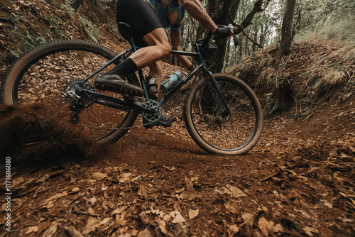 Cyclist Skidding on Dirt in Action with Gravel Bike