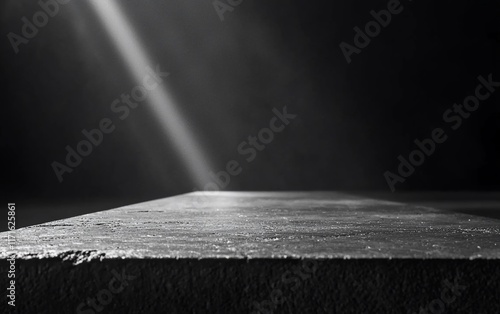 Dramatic light on empty concrete surface.