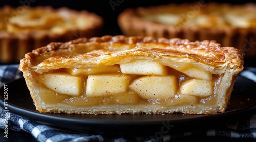 Delicious apple tart displayed on a checkered cloth in a cozy kitchen setting