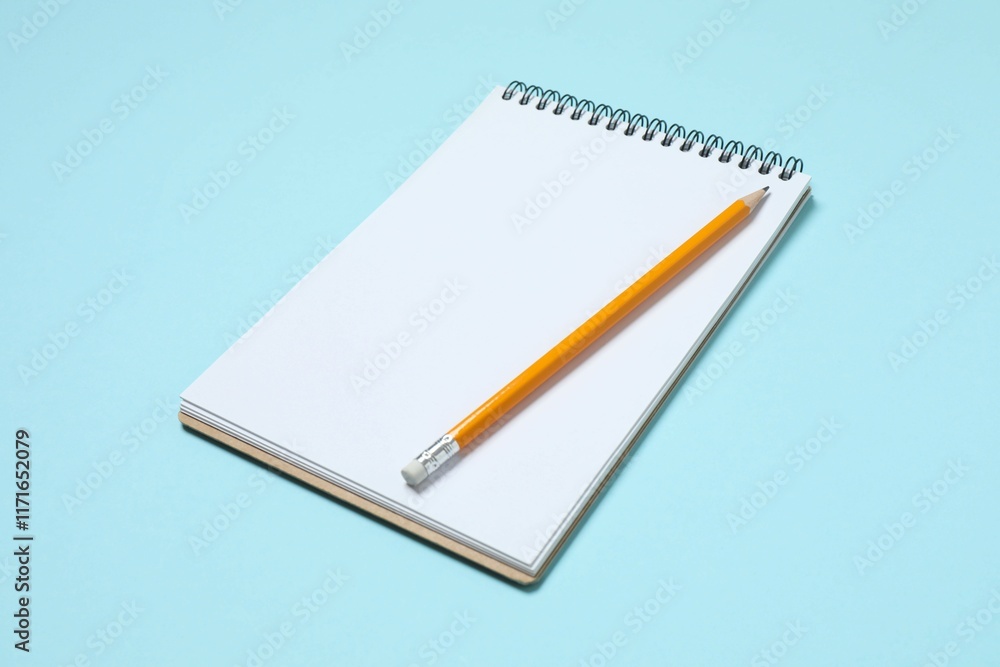 Top view photo of notebook with a pencil on color background with blank space. Business concept Top view photo of notebook with a pencil on color background with blank space. Business concept