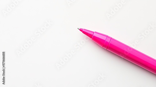 Bright pink pen rests on clean white surface, inviting creativit photo