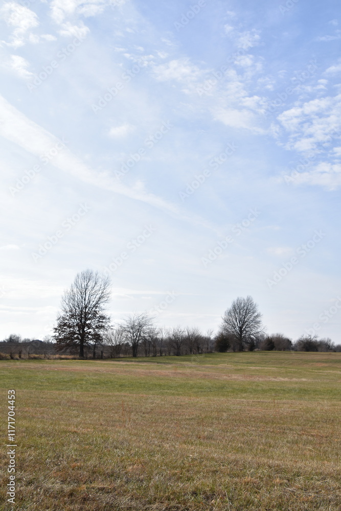 Fototapeta premium Clouds Over a Farm Field