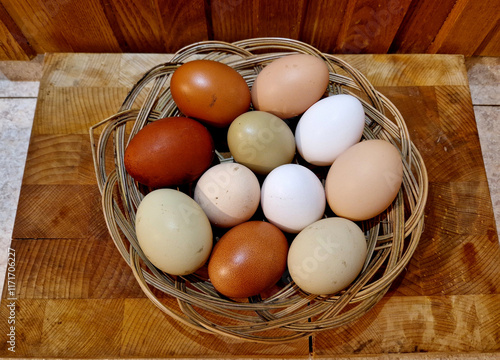 eggs from several types of hens. various shades from brown to white. even greenish eggs in a paper bag from the farm photo