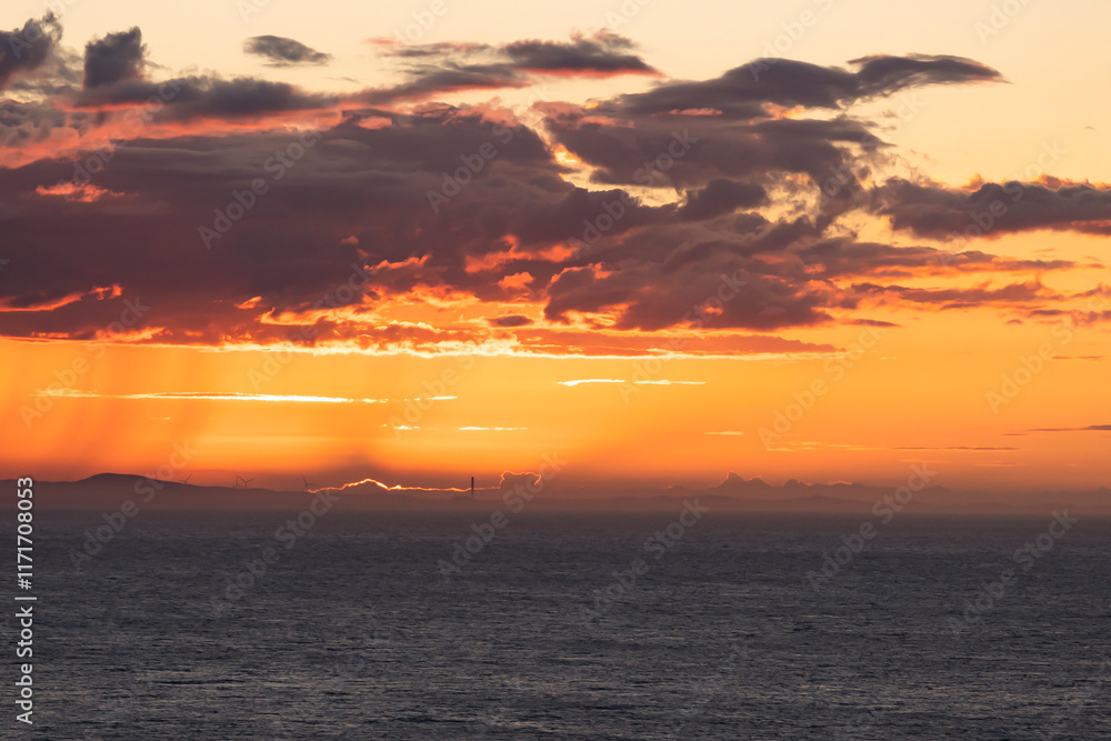 Naklejka premium Dramatic sky over the sea at sunset. Sardinia