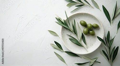 Fresh green leaves arranged on neutral plates for a natural dining experience...