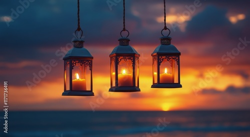 Lanterns glowing softly by the water during a vibrant sunset near the shore