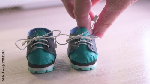 close-up demonstration of doll shoes