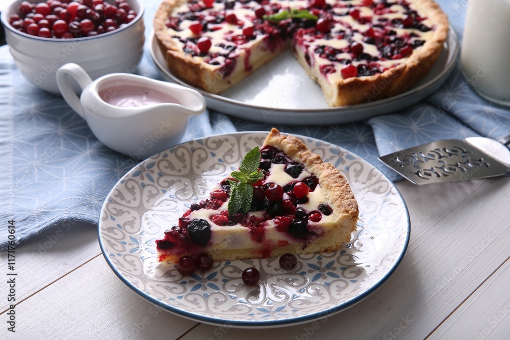 Piece of delicious currant pie served on white wooden table Piece of delicious currant pie served on white wooden table