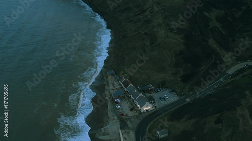 Discover breathtaking cliffs and sandy shores in Saltburn by the Sea during golden hour photo