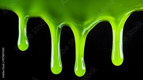 Dripping liquid green on a black background