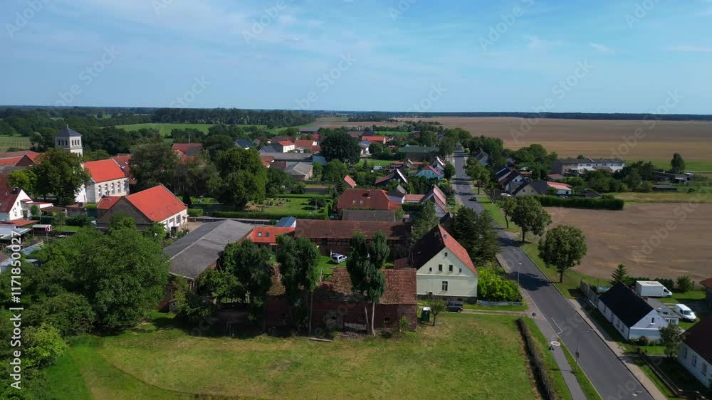 Village in Brandenburg, agricultural fields. Smooth aerial view flight drone Village in Brandenburg, agricultural fields. Smooth aerial view flight drone