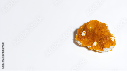 Auripigment (orpiment, arsenic mineral) isolated on white photo