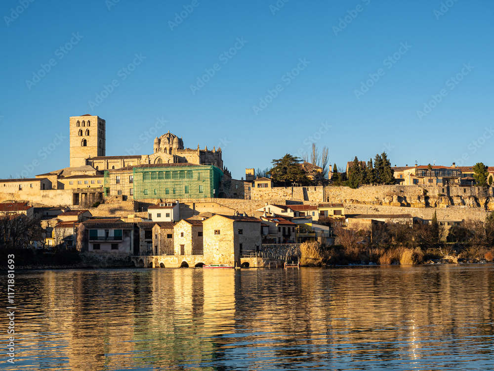 Fototapeta premium View of the Zamora cathedral, the wall and the Olivares water mills on the Duero River. Zamora. Castilla y León. Spain