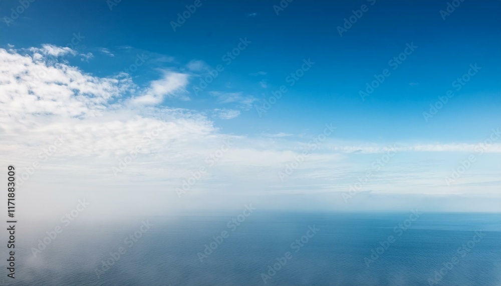 Misty ocean view under a bright blue sky. Misty ocean view under a bright blue sky.