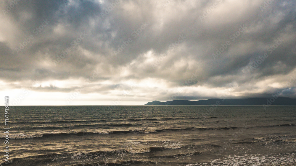 stunning warm sunset on a sea ocean sun water dramatic skies kapiti new zealand stunning warm sunset on a sea ocean sun water dramatic skies kapiti new zealand