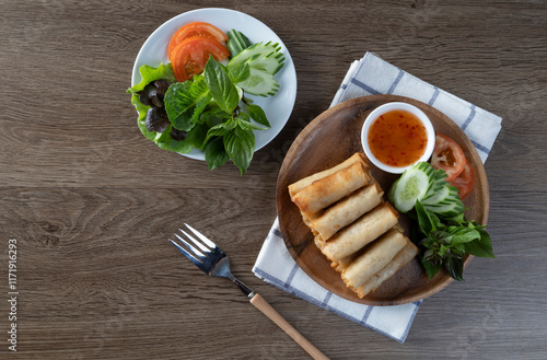 Spring rolls are a large variety of filled, rolled appetizers or dim sum found in East Asian and Southeast Asian cuisine photo