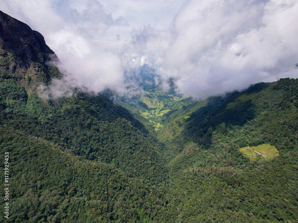 Green Mountains Surrounded by Crops on a Slightly Cloudy Day in Salento, Quindío, Colombia