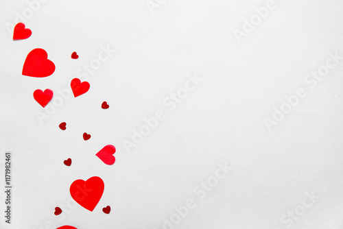 Red heart shapes and confet...
