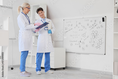 Chemists with clipboard wor...