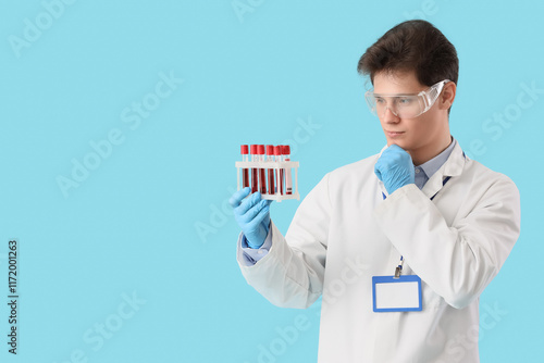 Thoughtful male chemist wit...