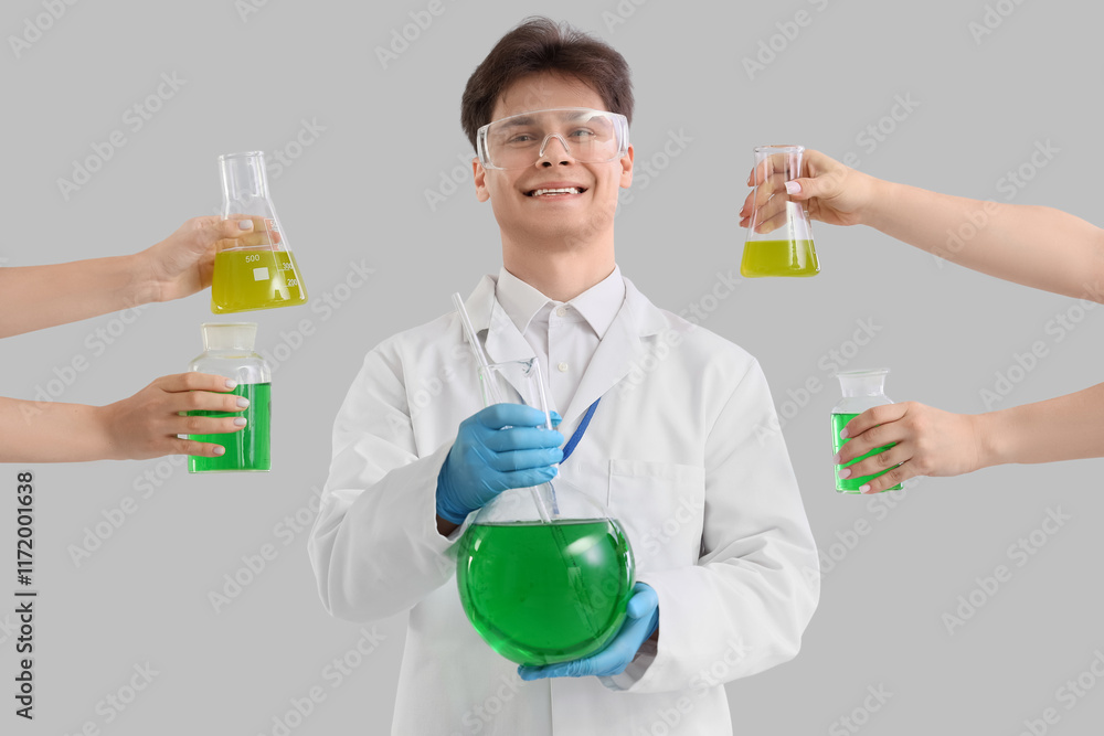 Male chemist and female hands with flasks on light background Male chemist and female hands with flasks on light background