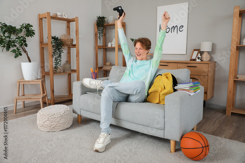 Happy male student playing ...