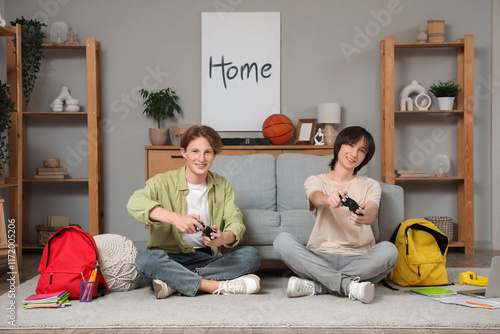 Male students playing video...