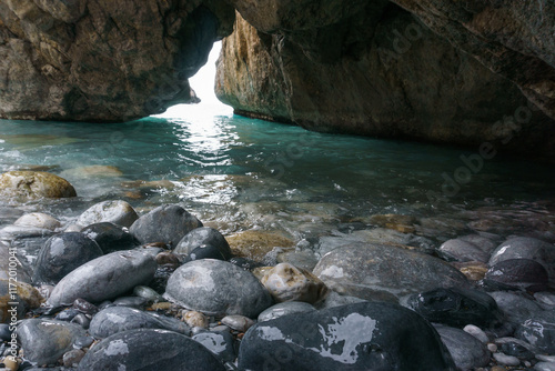 Famous rocky beach Foneas near Kardamyli village with turquoise colored water in spring time, Messinia, Peloponnese, Greece photo