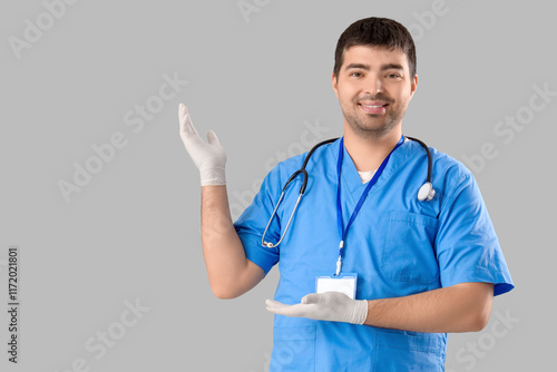 Male doctor showing somethi...