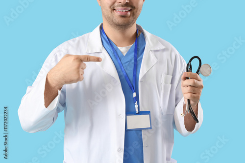 Male doctor pointing at ste...