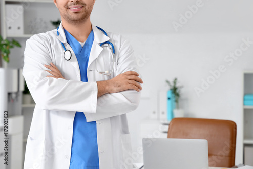 Male doctor with crossed ar...