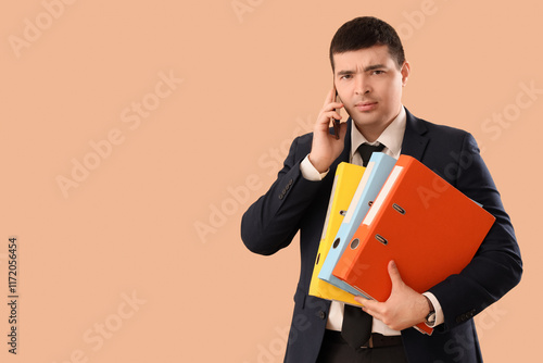 Young businessman with fold...