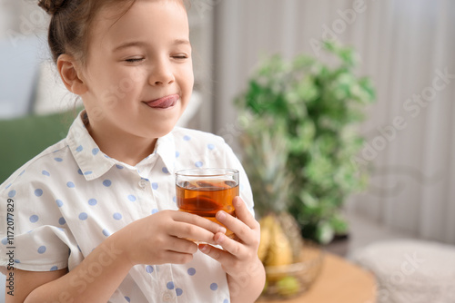 Cute little girl with juice...
