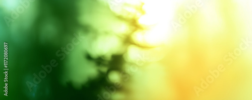 Abstract green and yellow blurred background creating a soft and dreamlike ef...