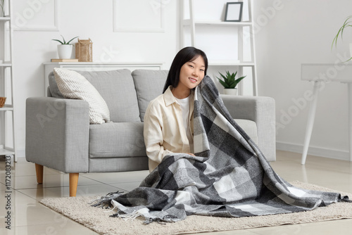 Young Asian woman with plai...