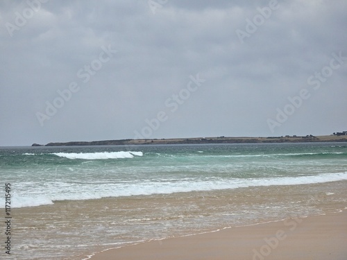 Scenic View of Forest Caves Beach in Australia with Waves Crashing on Sandy Shore under Cloudy Sky