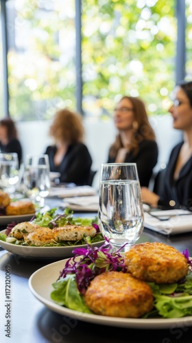 Professionals Enjoying Fishcake Dish at Bright Corporate Lunch Setting